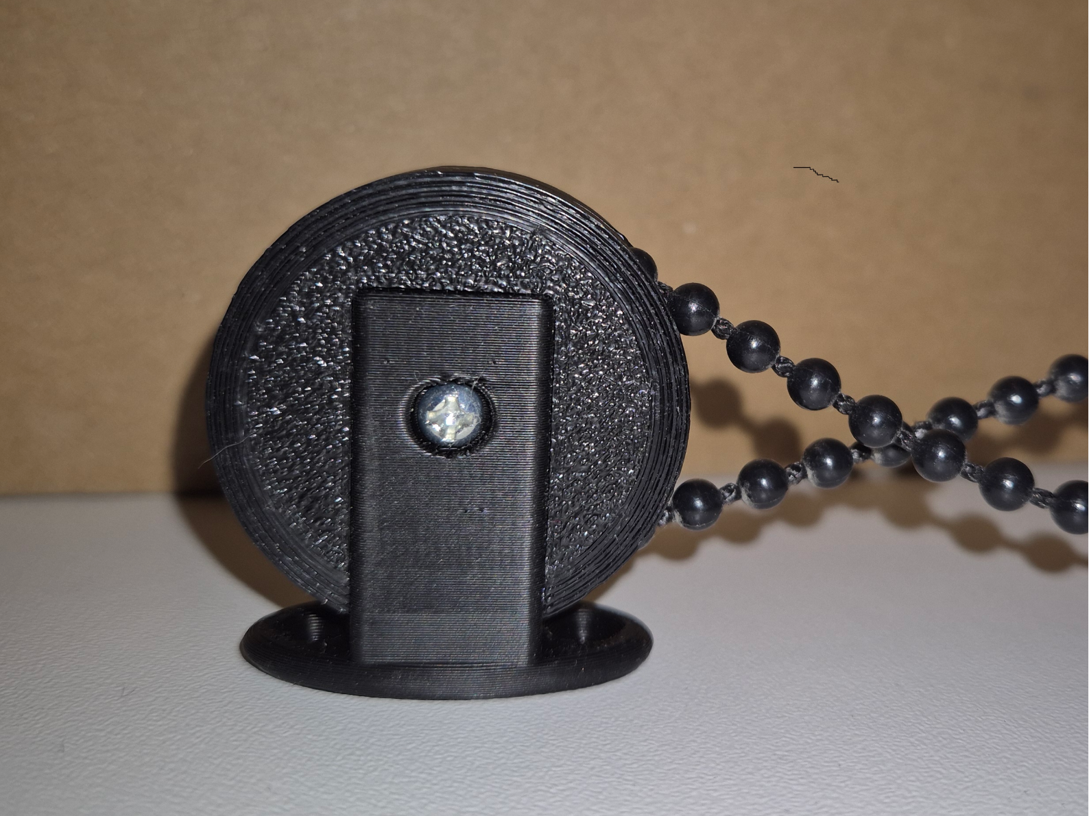 Wall mount for bead chain to blinds.