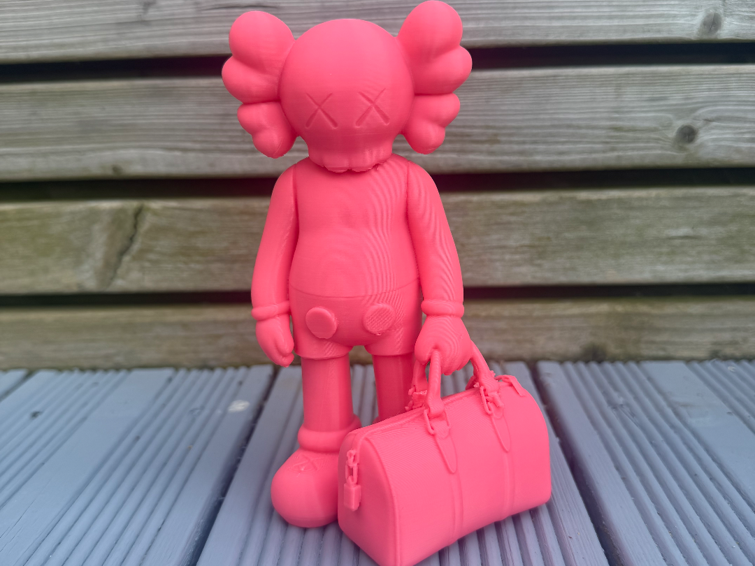 Kaws Companion Holding a Duffle bag