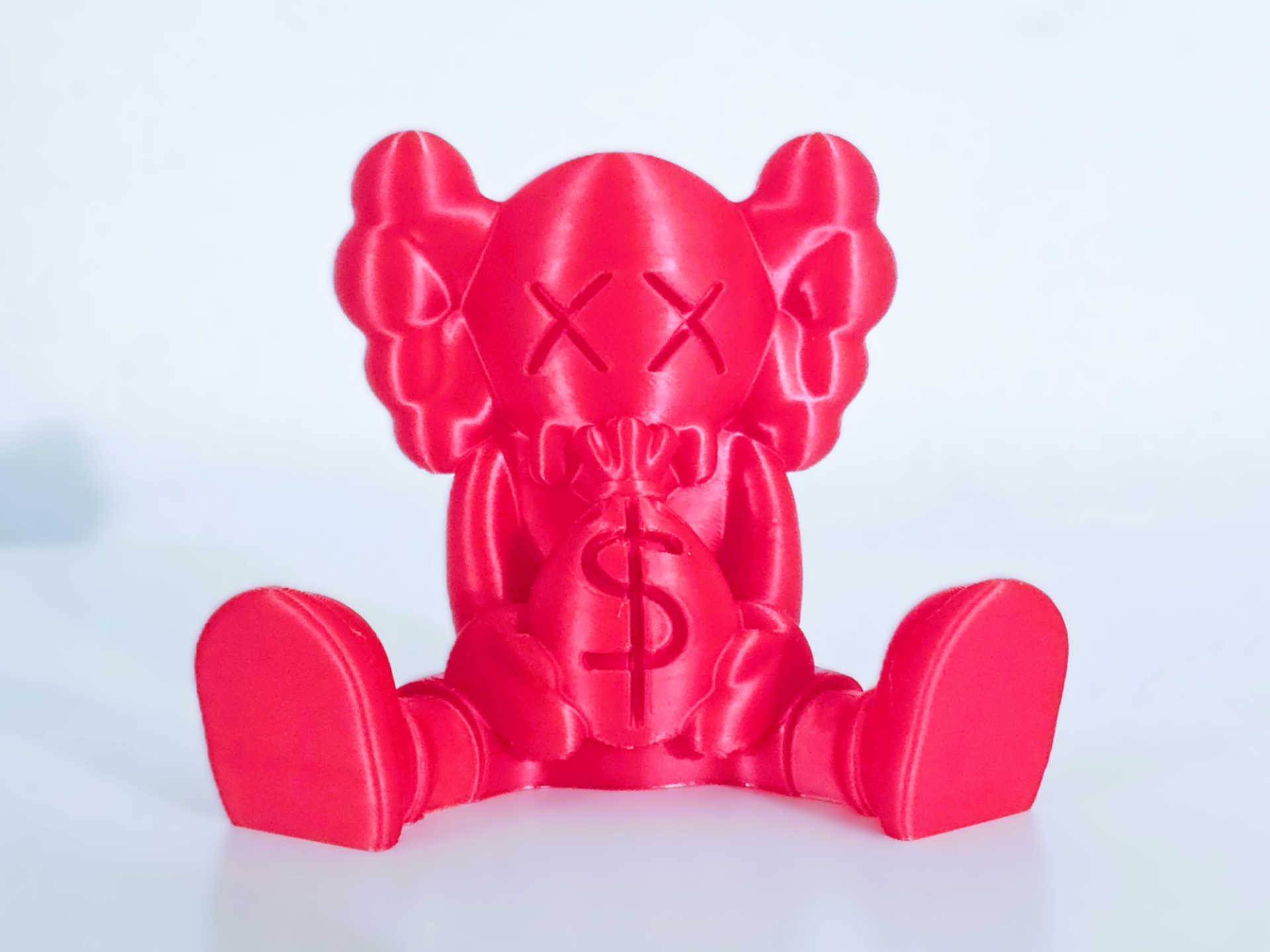 Kaws money bag figure