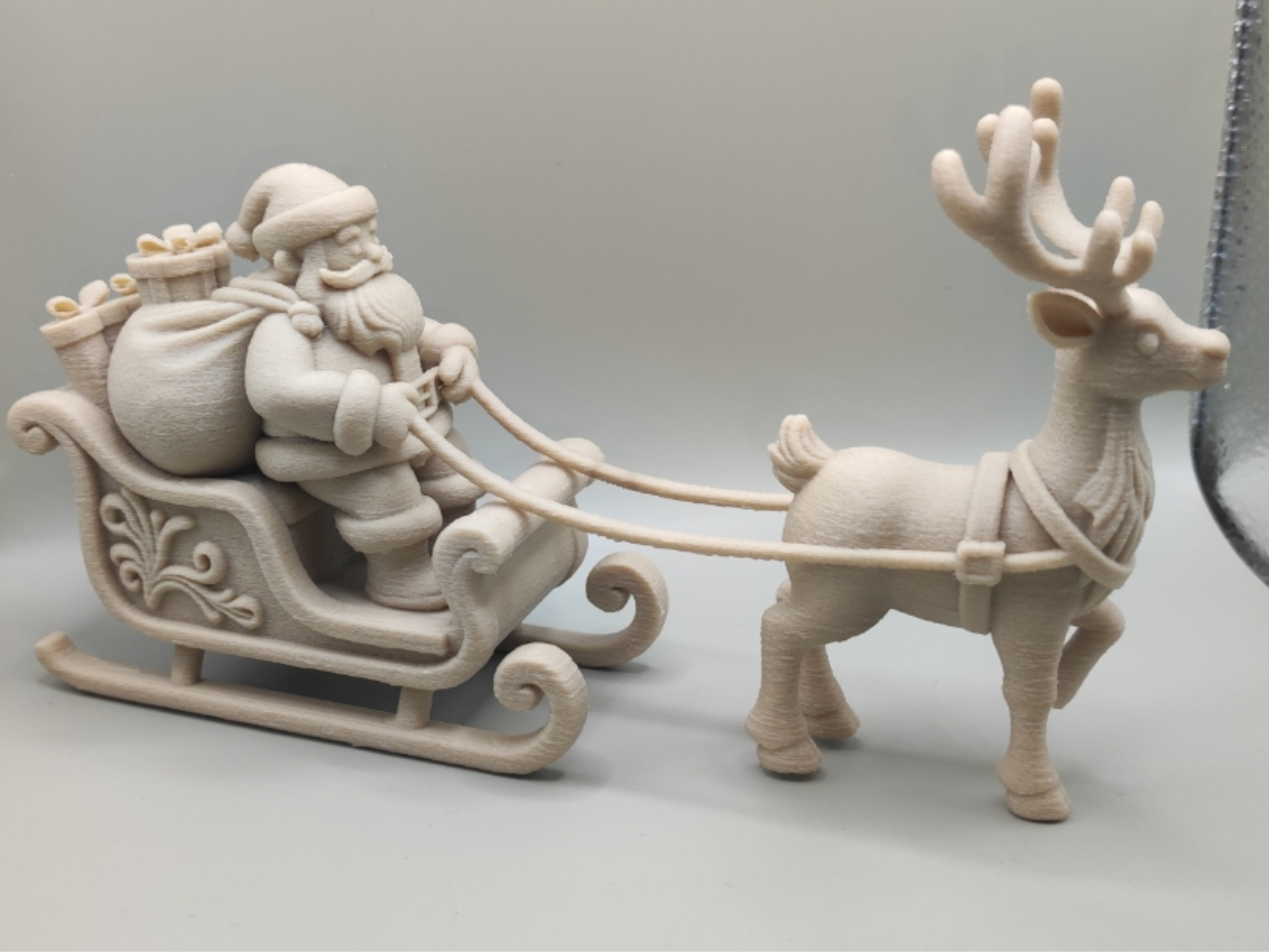 reindeer, sleigh, Santa Claus figurine