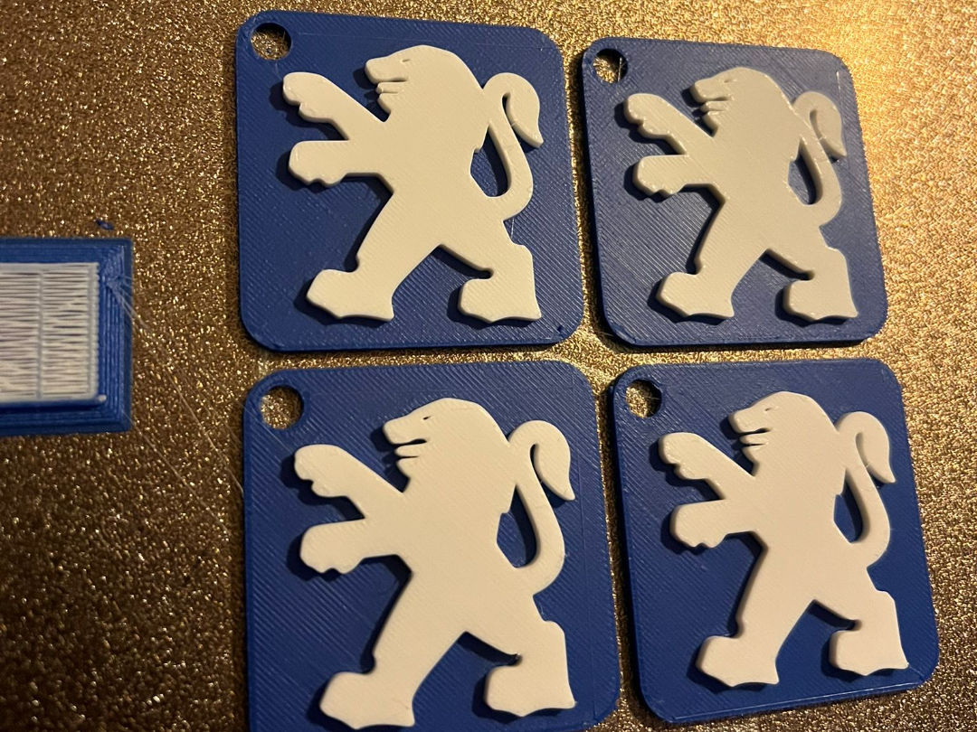 Peugeot logo keychain