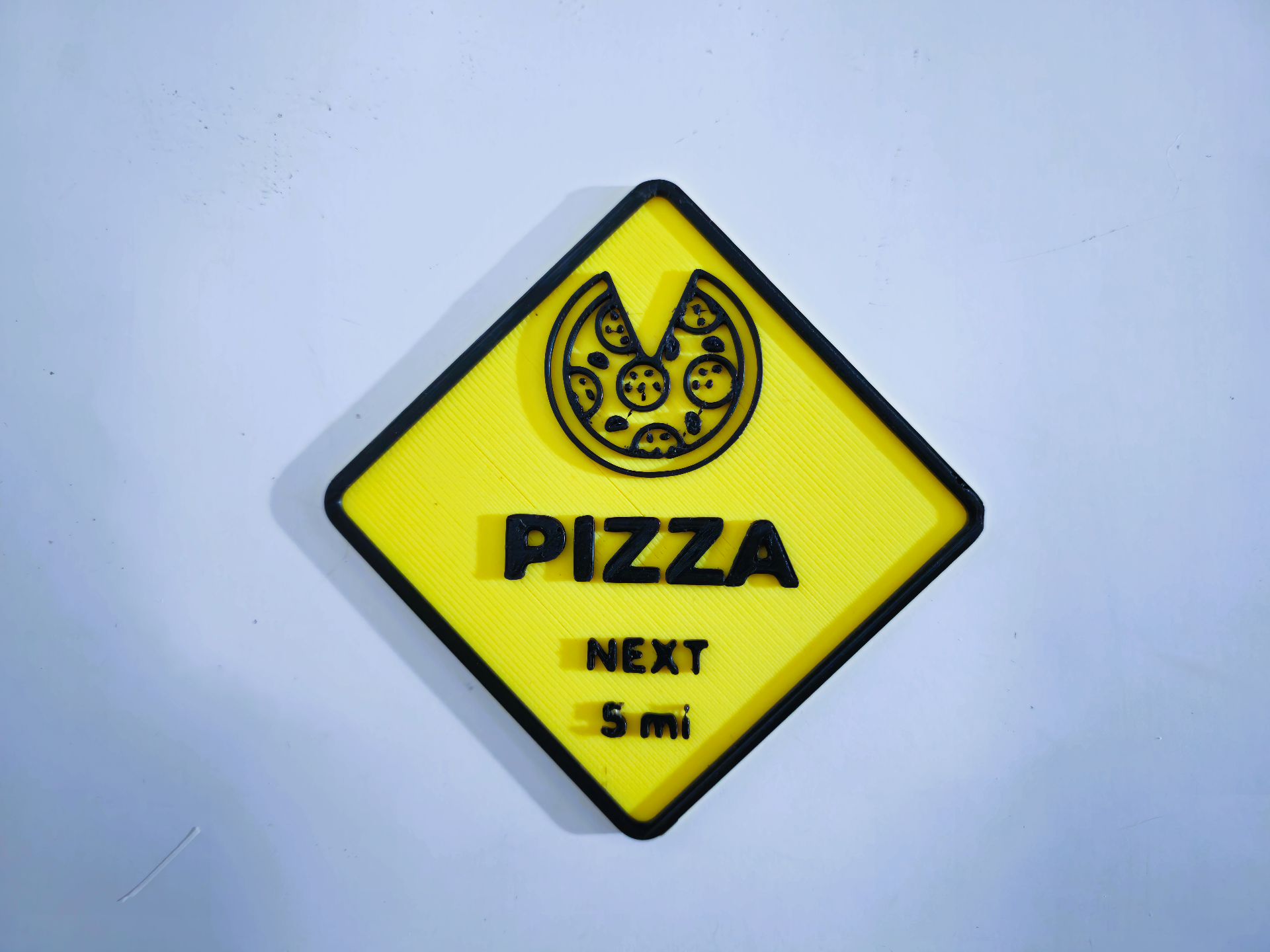 Pizza road sign