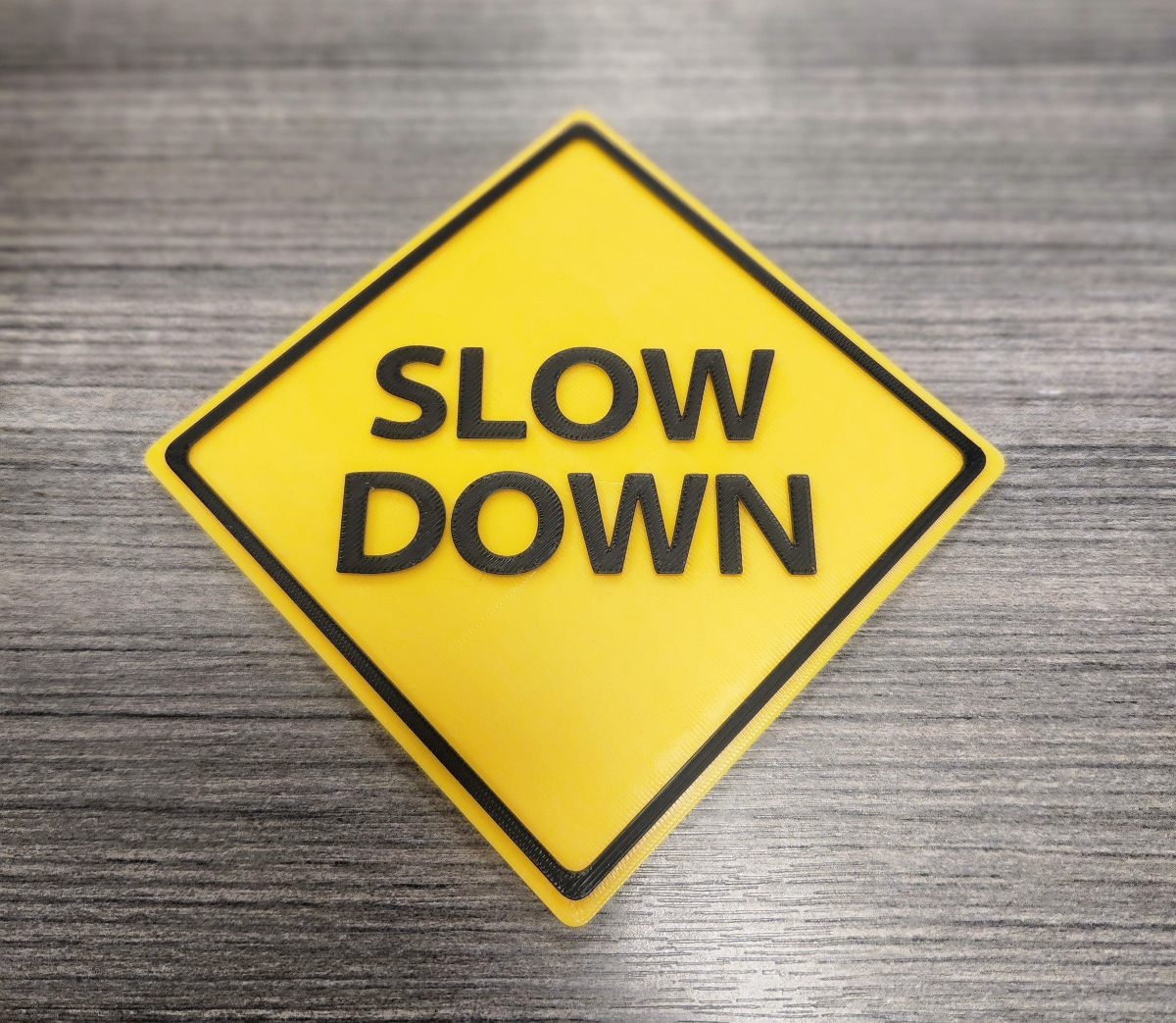 Slow Down Street Sign