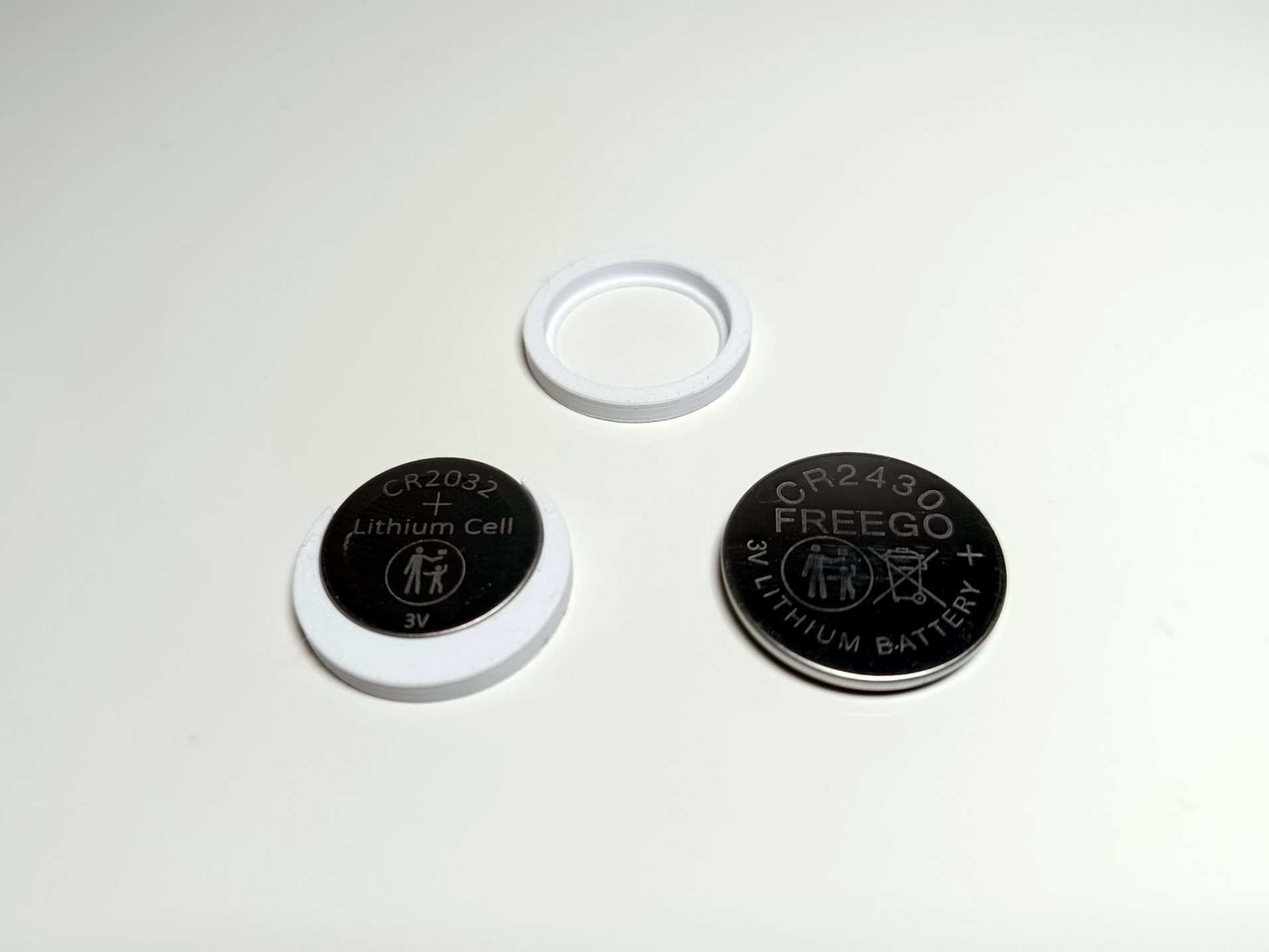 Adapter for CR2032 batteries in CR2430 holder