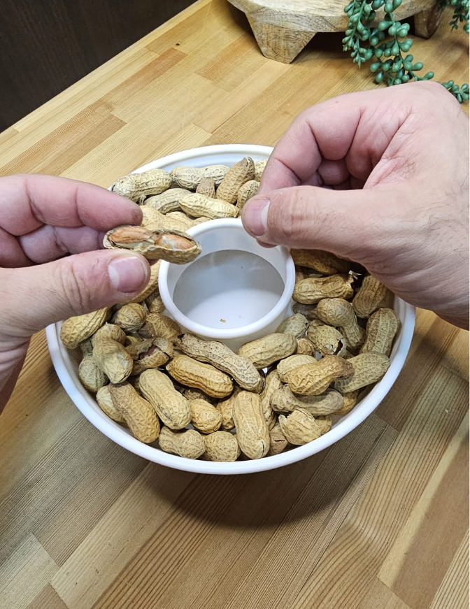 Peanut dispenser with waste disposal