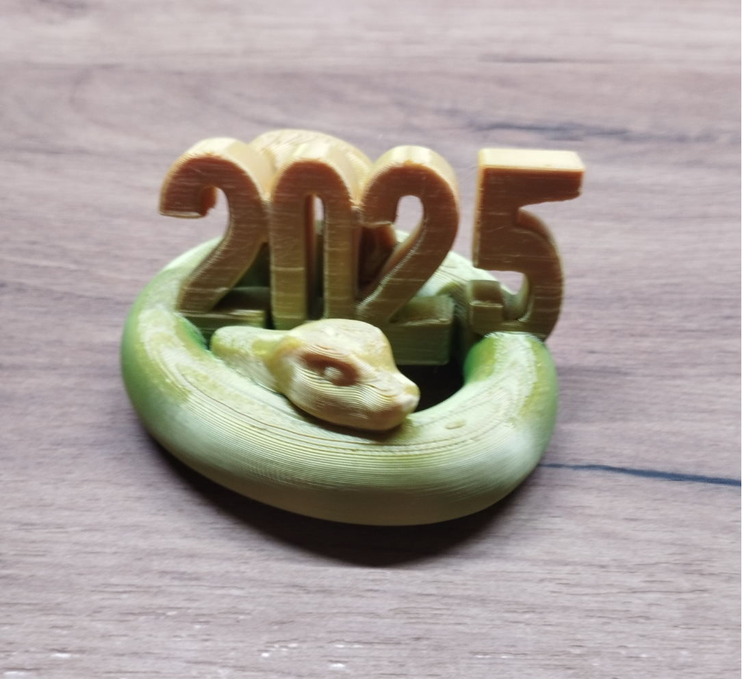 Statue of snake holding sign 2025