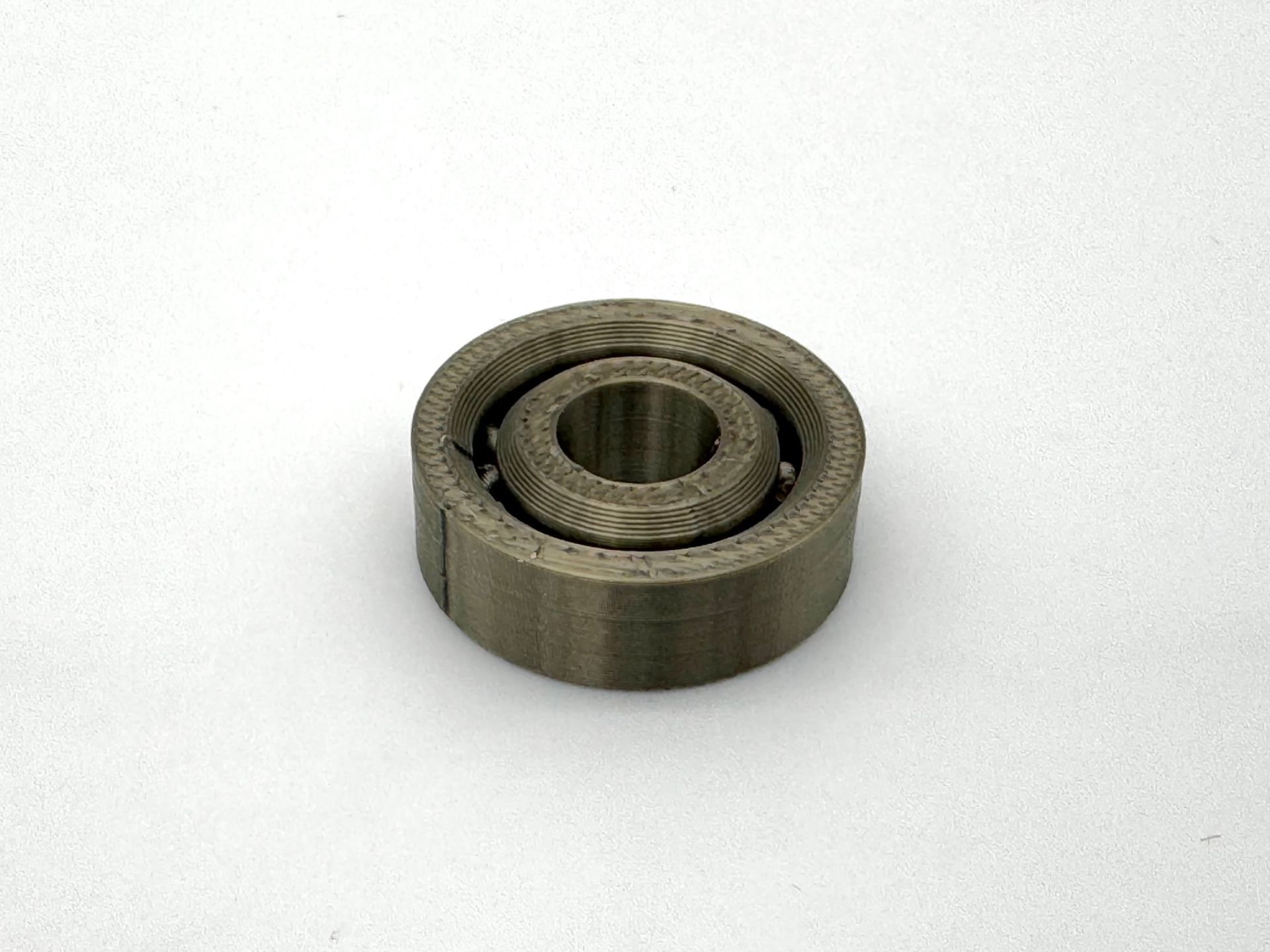 608 ball bearing (spins smoothly just off the bed)