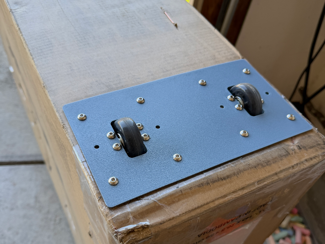 add caster wheels to your cardboard bike box