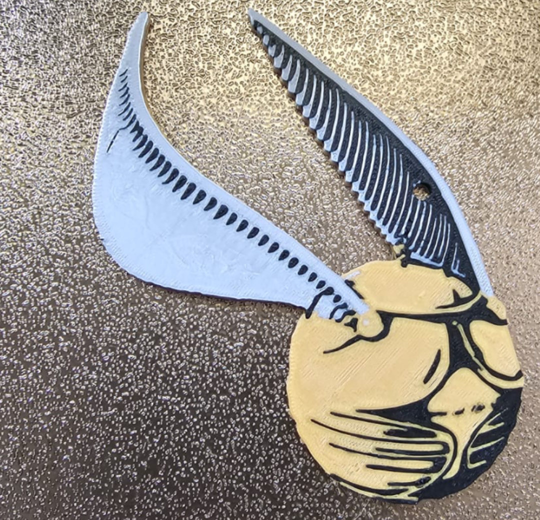golden snitch backpack keychain