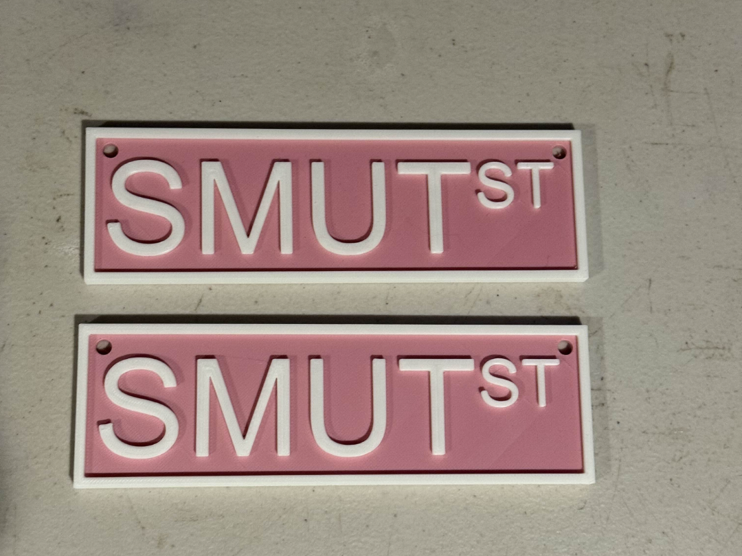 Smut street sign