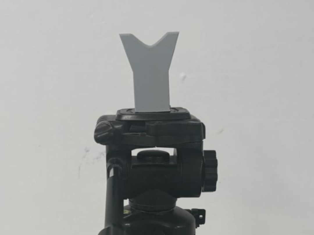 Gun rest for camera tripod