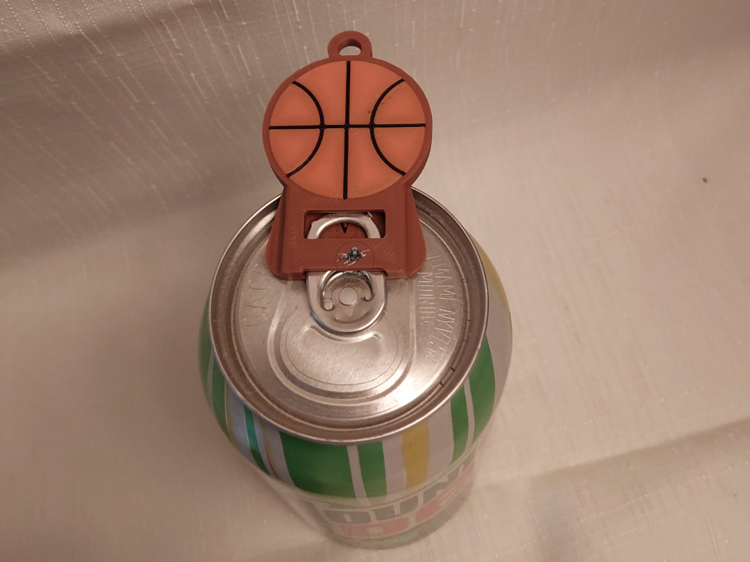 Basketball drink tab opener
