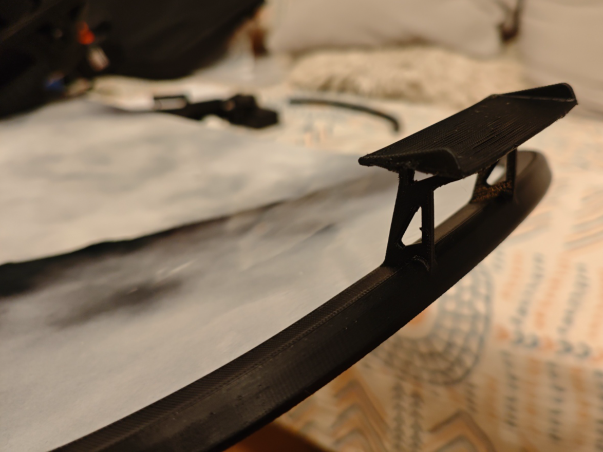 Snowboard bumper with spoiler (rear protection)