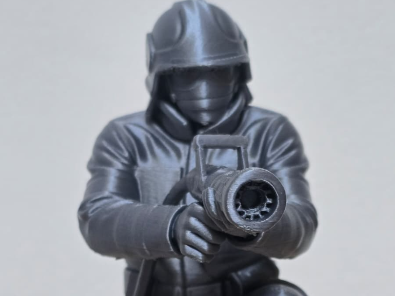 Firefighter Aiming Fire Hose