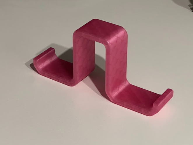 Double-sided headphone hook for divider wall