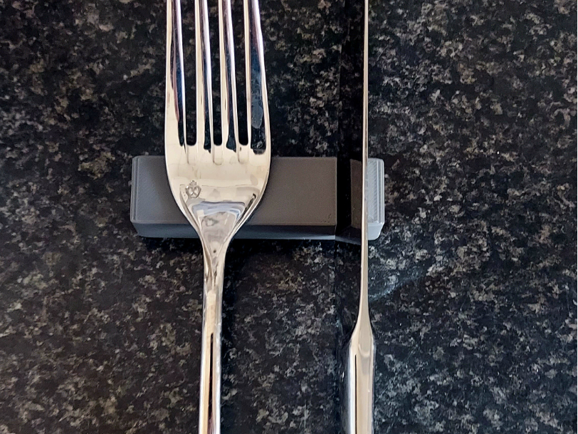 Elegant Fork and Knife rest with knife cut