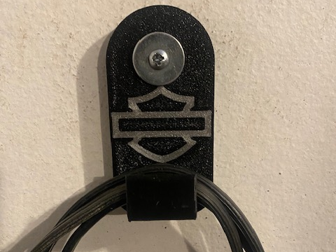 Harley trickle charger cord holder
