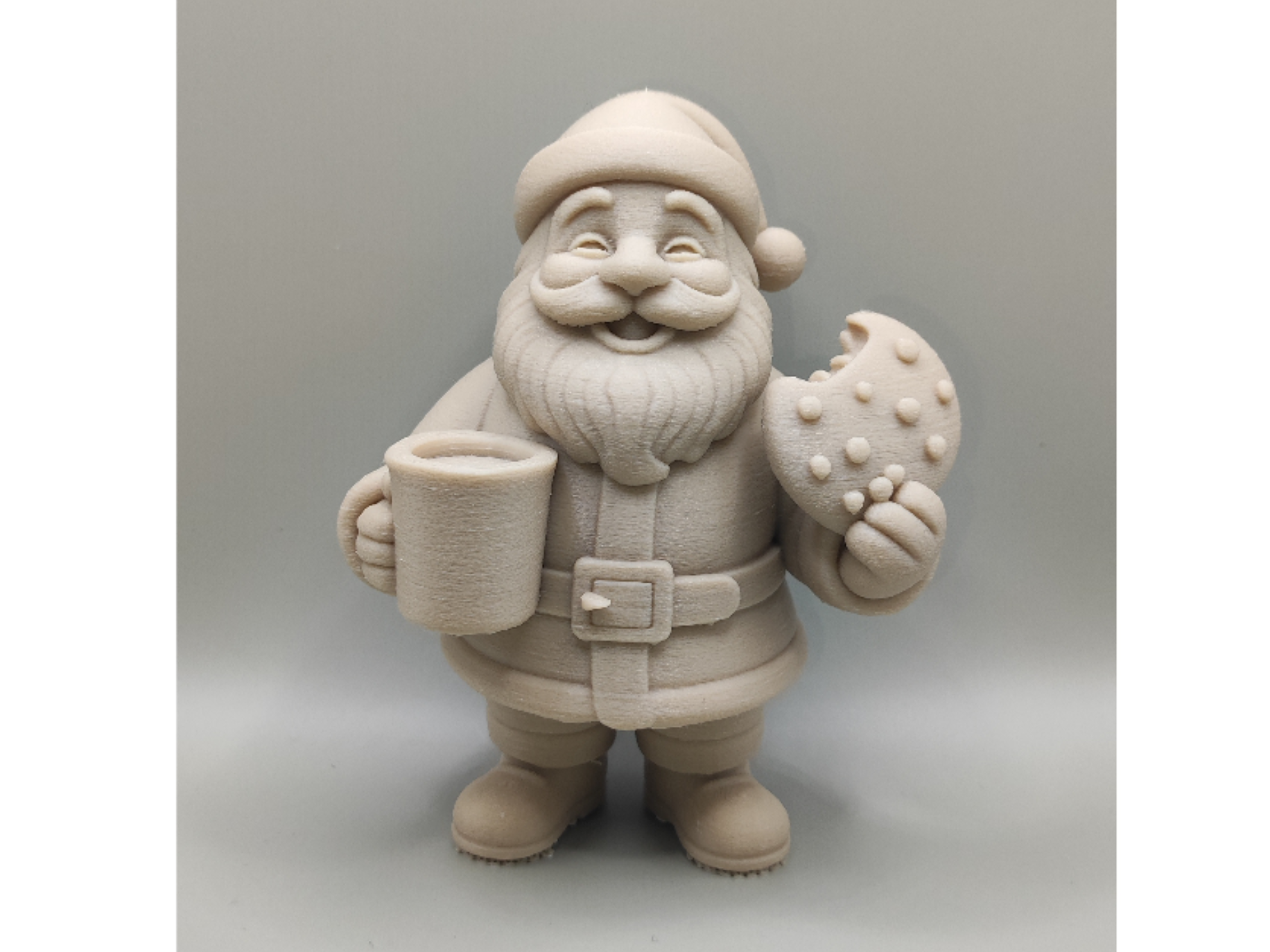 Santa Claus with milk and cookies figurine