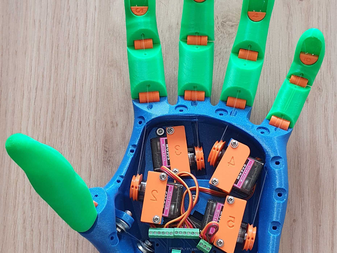 Voice activated low cost motorized hand