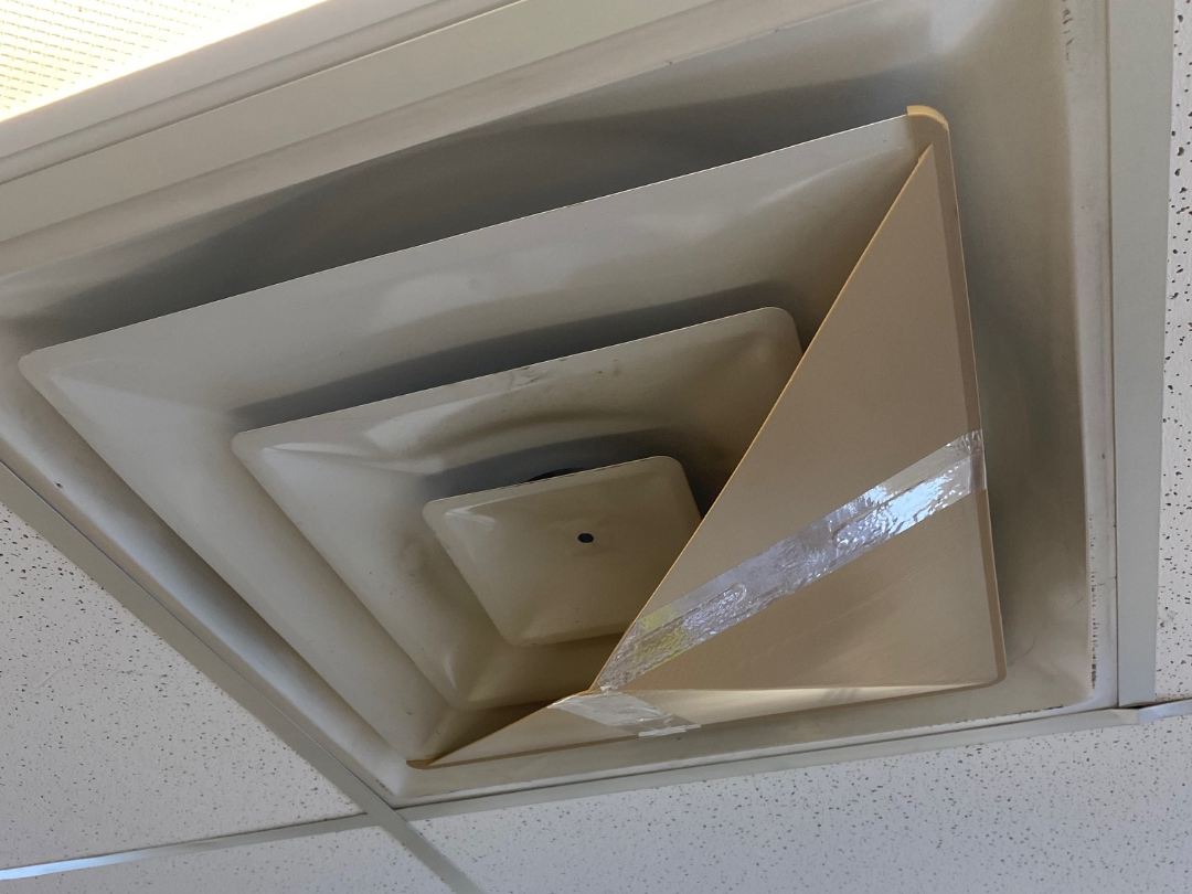 Ceiling HVAC vent deflector