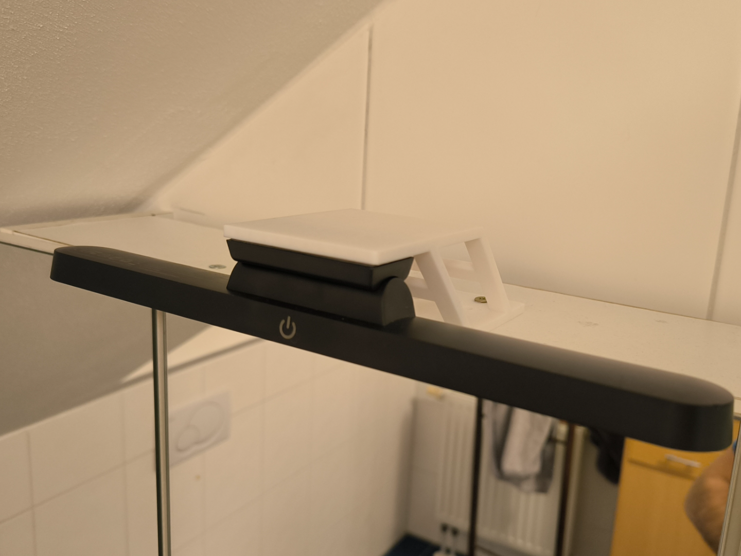 Lamp holder for mirror cabinet or wardrobe