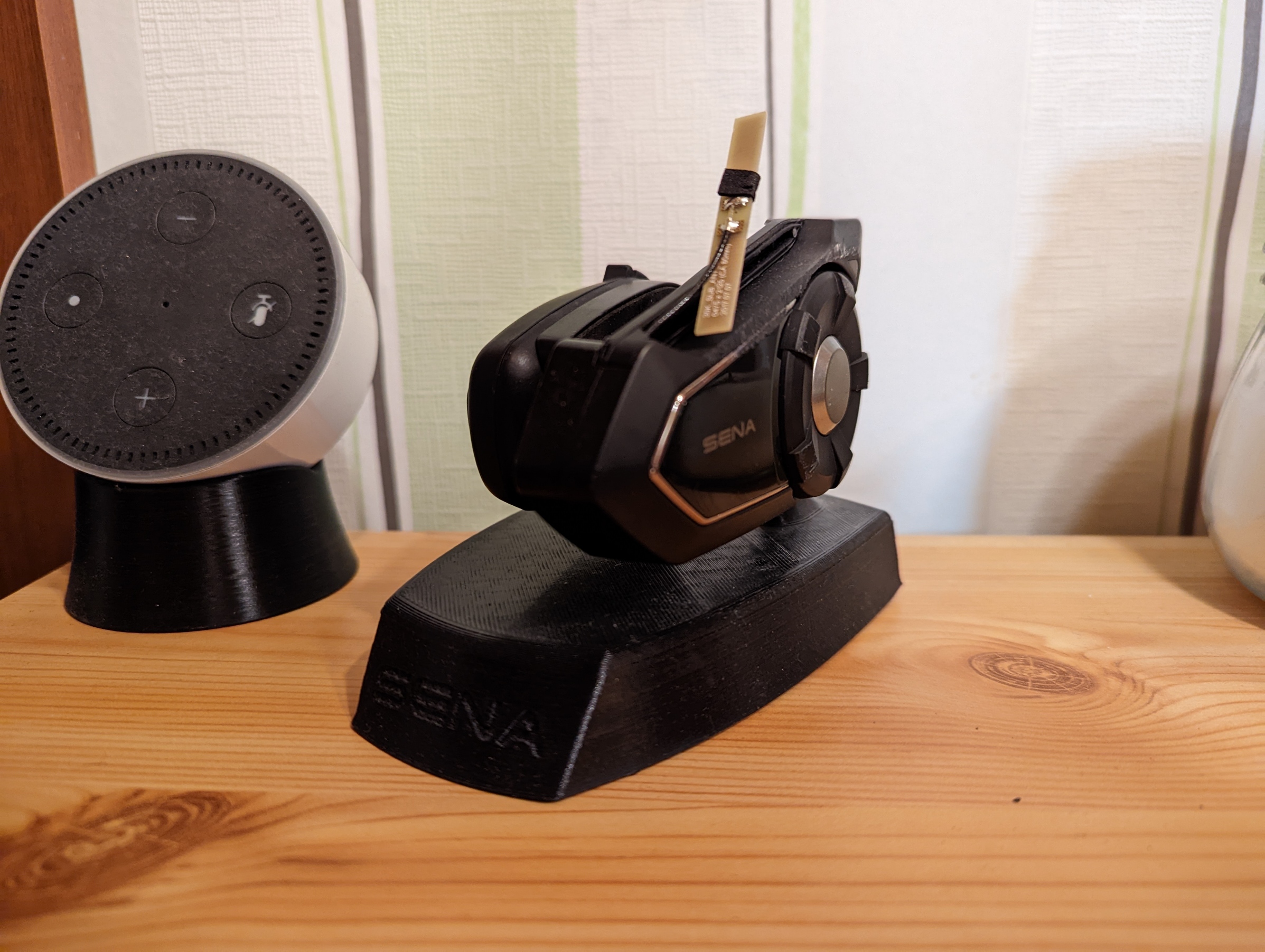 A charging station for a Sena30k and a Sena SMH5