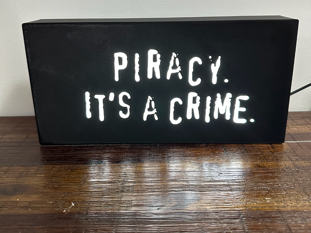 “Piracy. It's a crime” - light up sign