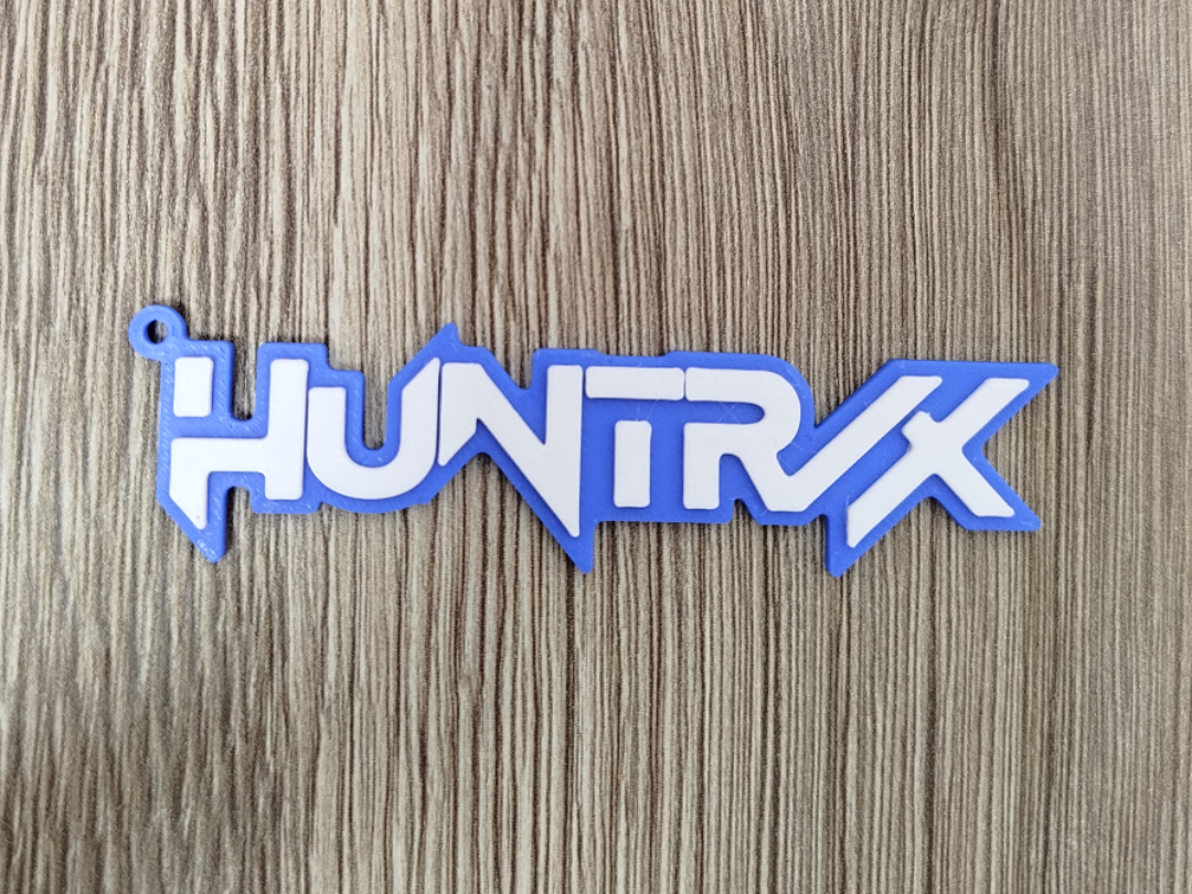 Llavero Huntr/x o Huntrix Bicolor con relieve