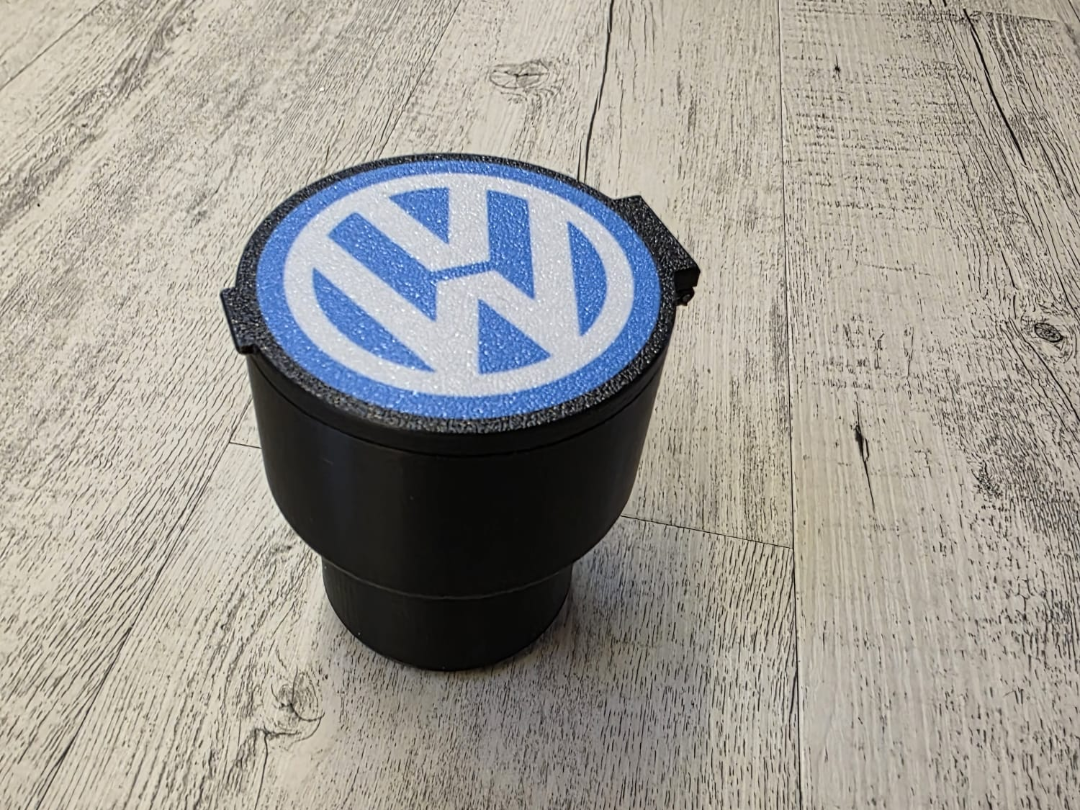 Behälter für Getränkehalter im Auto VW