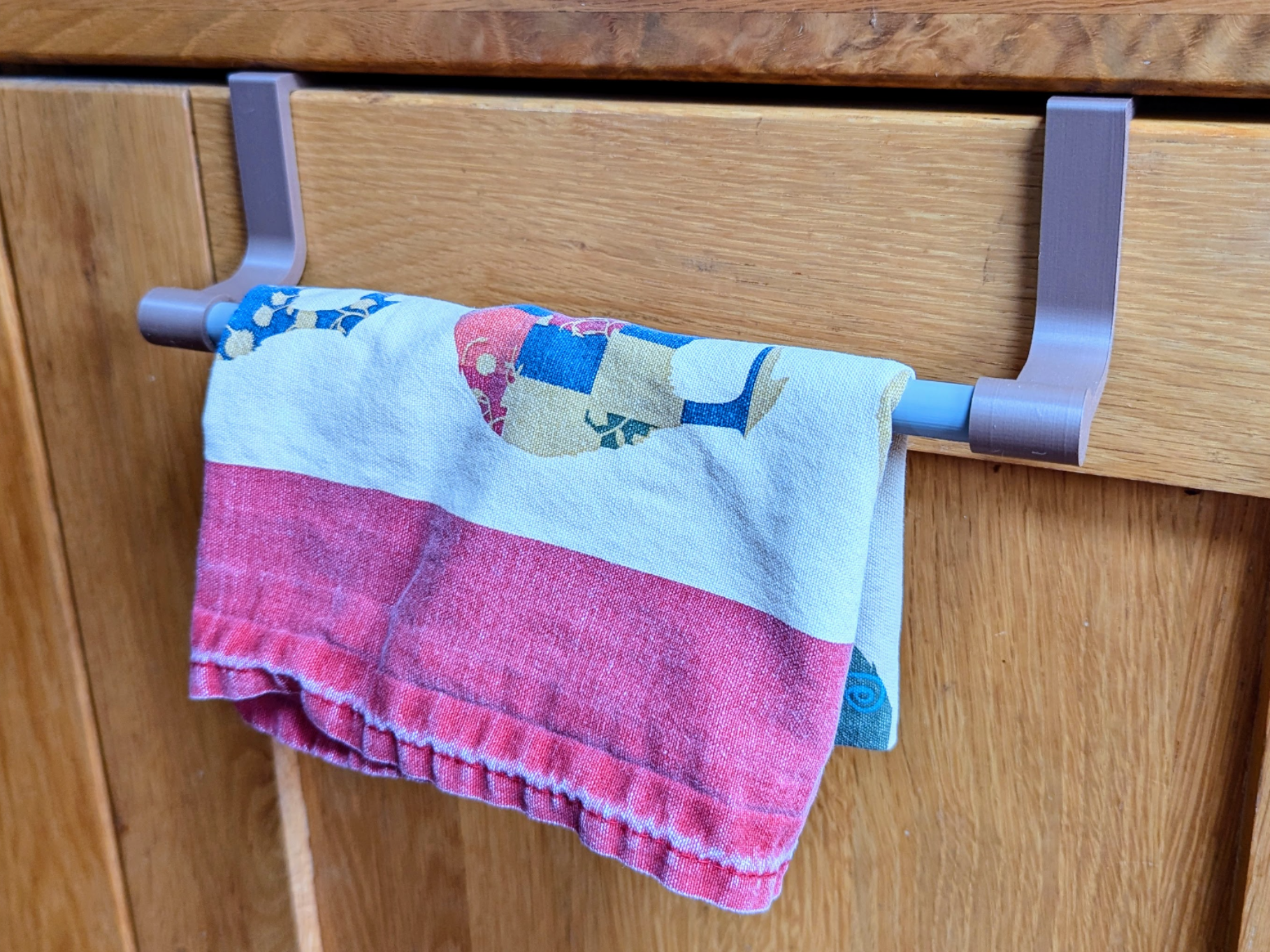 Kitchen cupboard tea towel holder rail