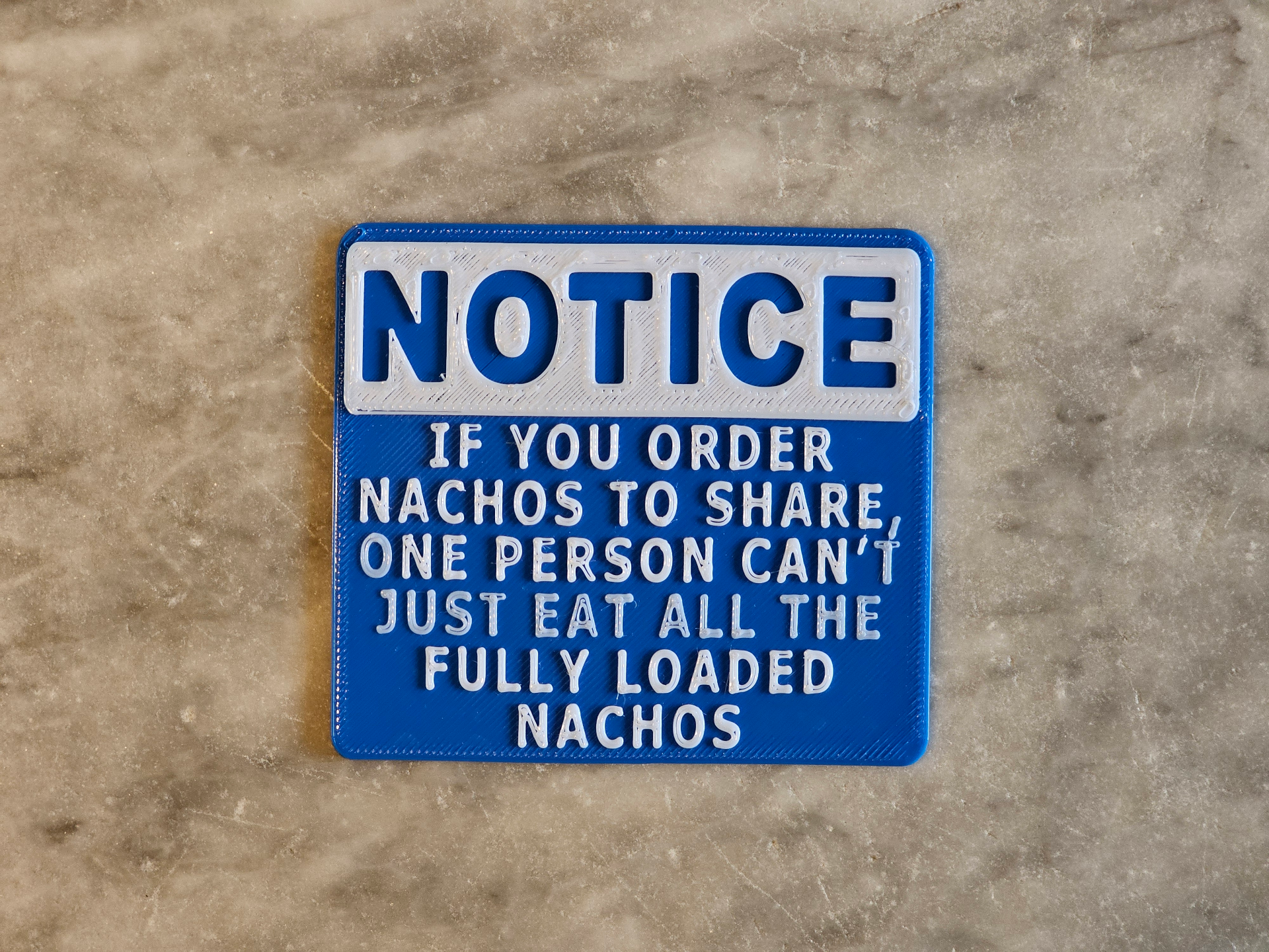 Nachos to share notice sign