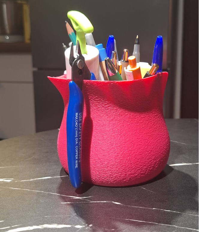 A small vase/container for various items,irregular