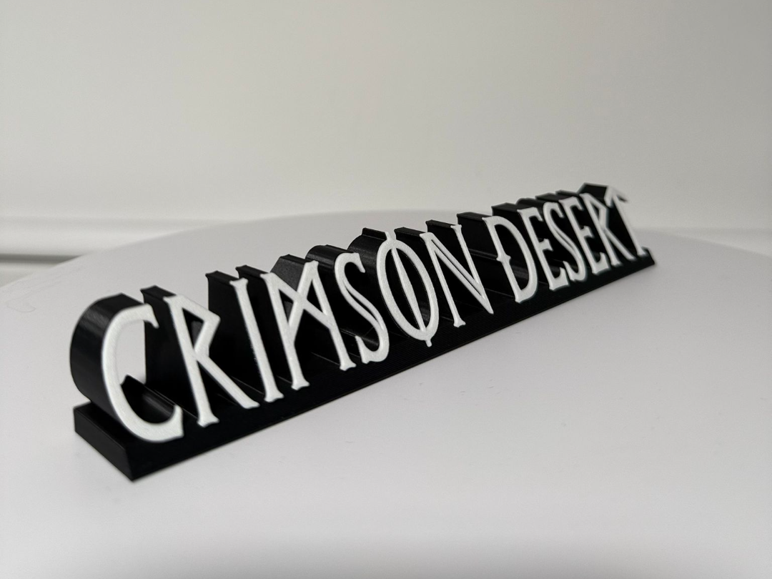 Crimson Desert desk shelf logo