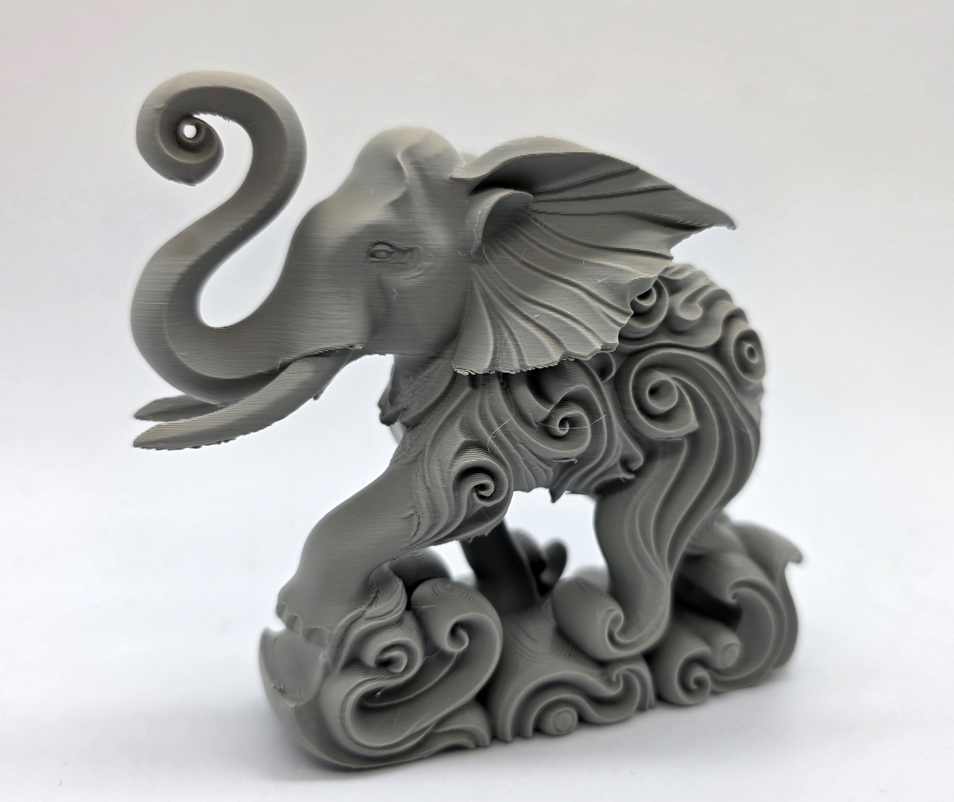 Swirl-Carved Elephant Splashing Sculpture