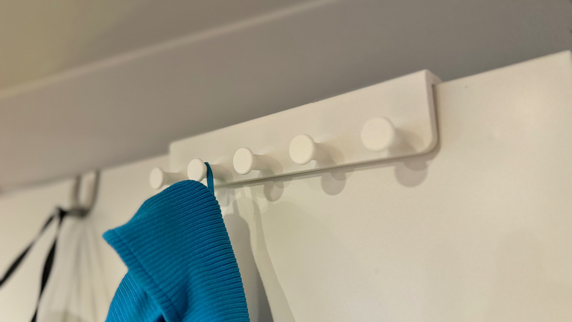 Jacket hangers for doors