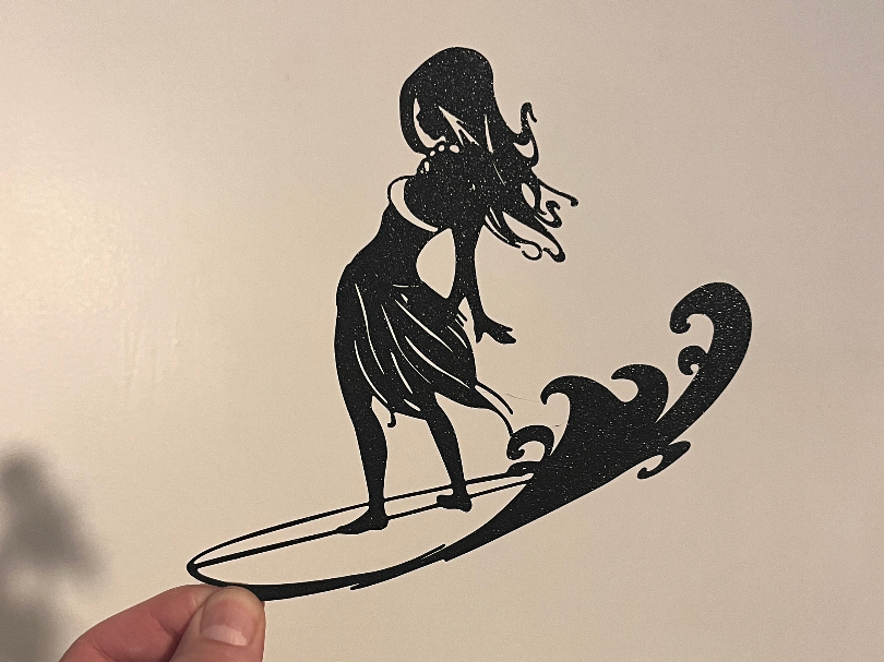 Vahine on a surfboard
