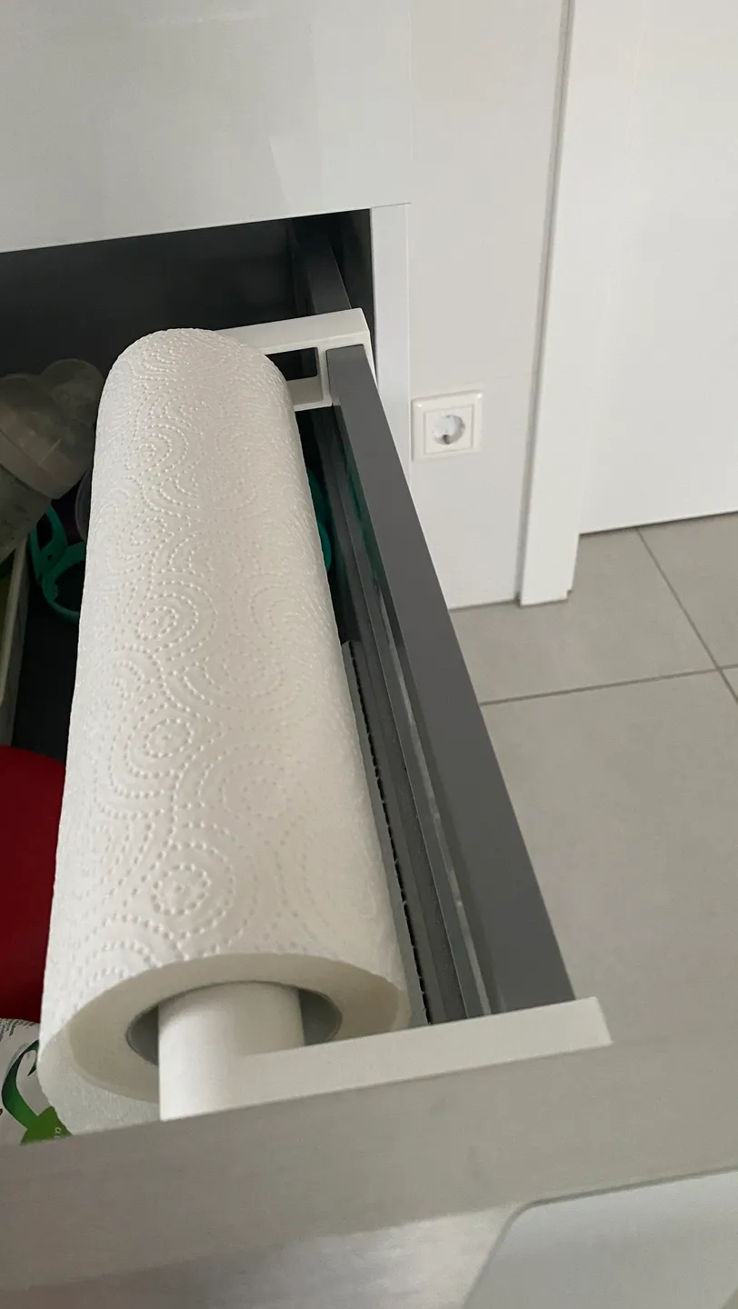 Kitchen roll holder in a drawer