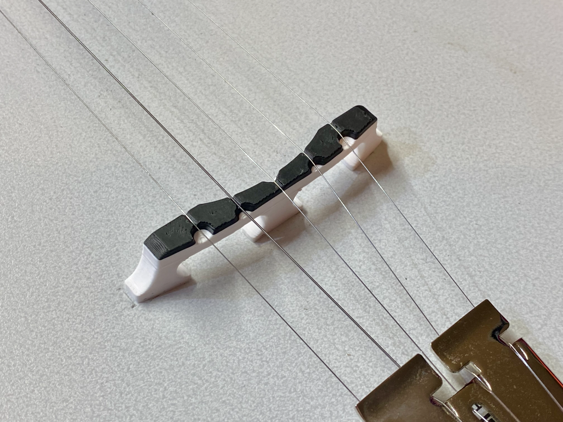 Compensated Banjo Bridge