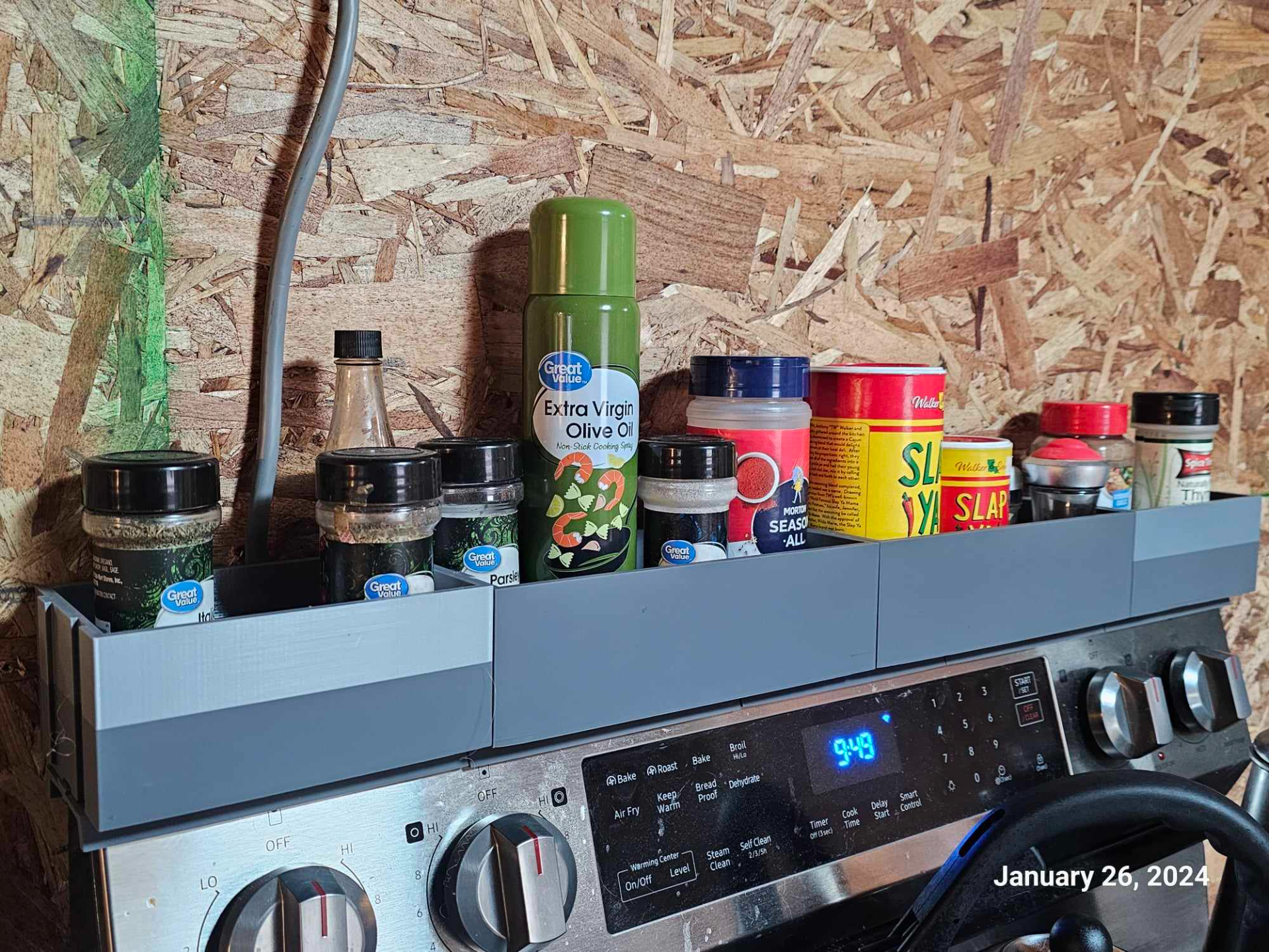 Magnetic spice rack for the back of an oven