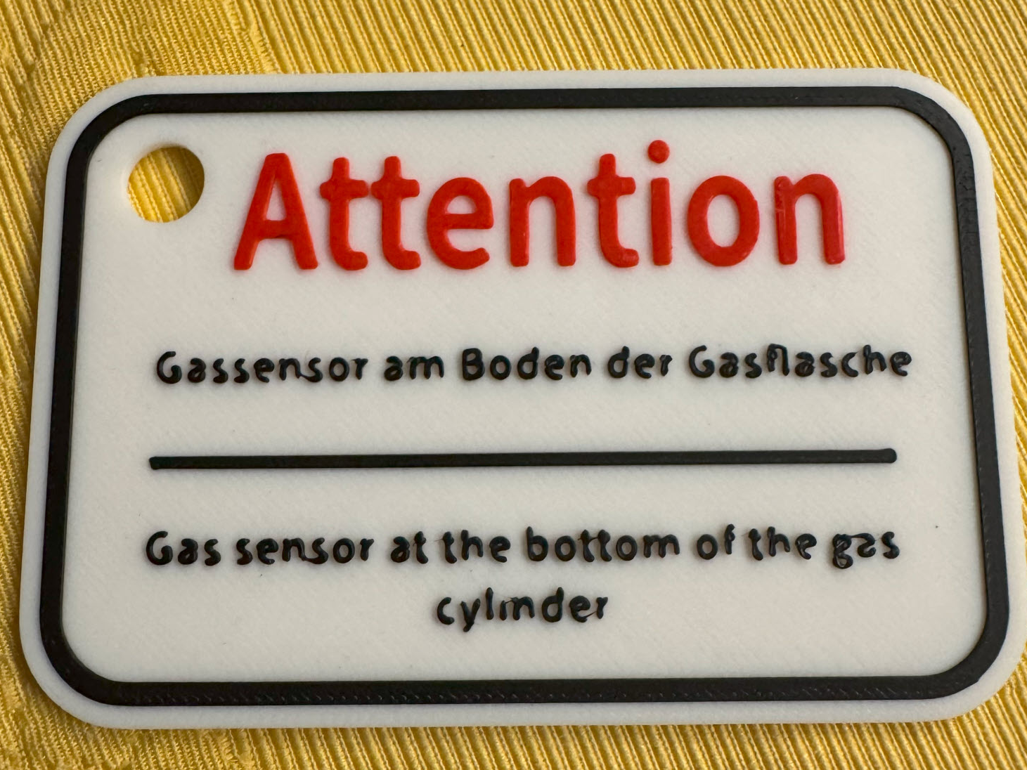 Hinweis auf Gassensor am Boden der Flasche