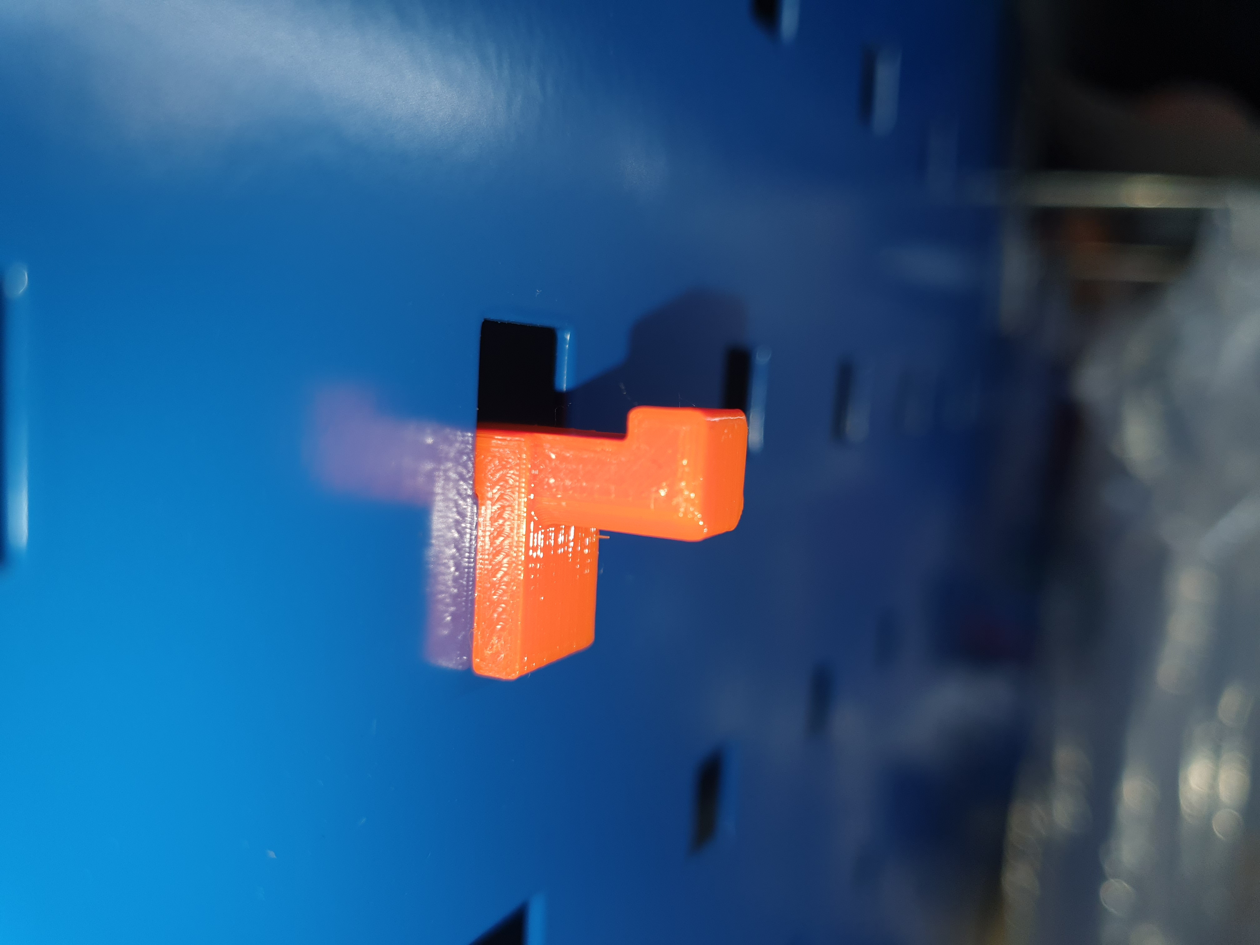 Metal board hook (with squared holes) - which fits in provided lock hole (use this negative into any object, which you want to hang).