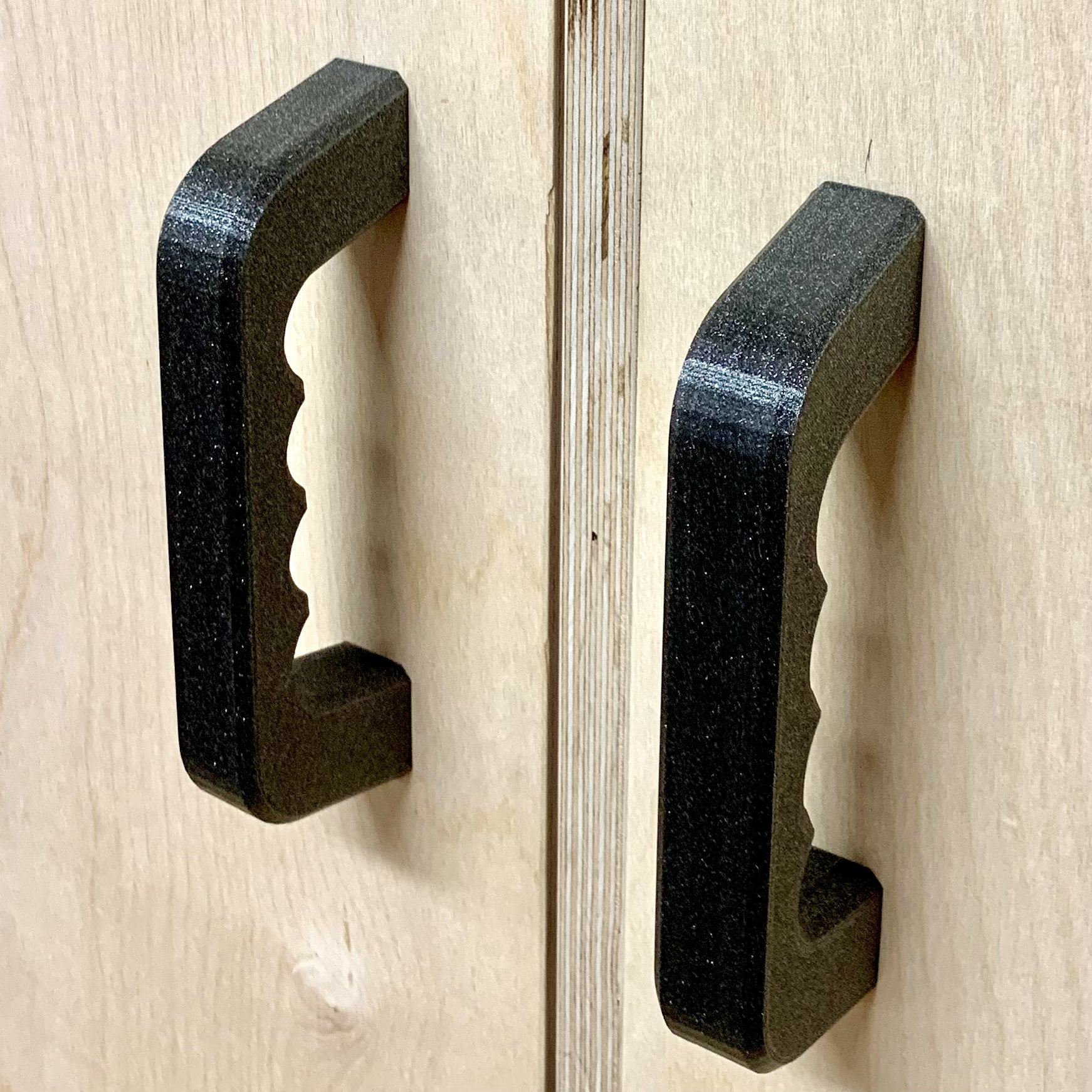 Handle with finger recesses for rear screw connection