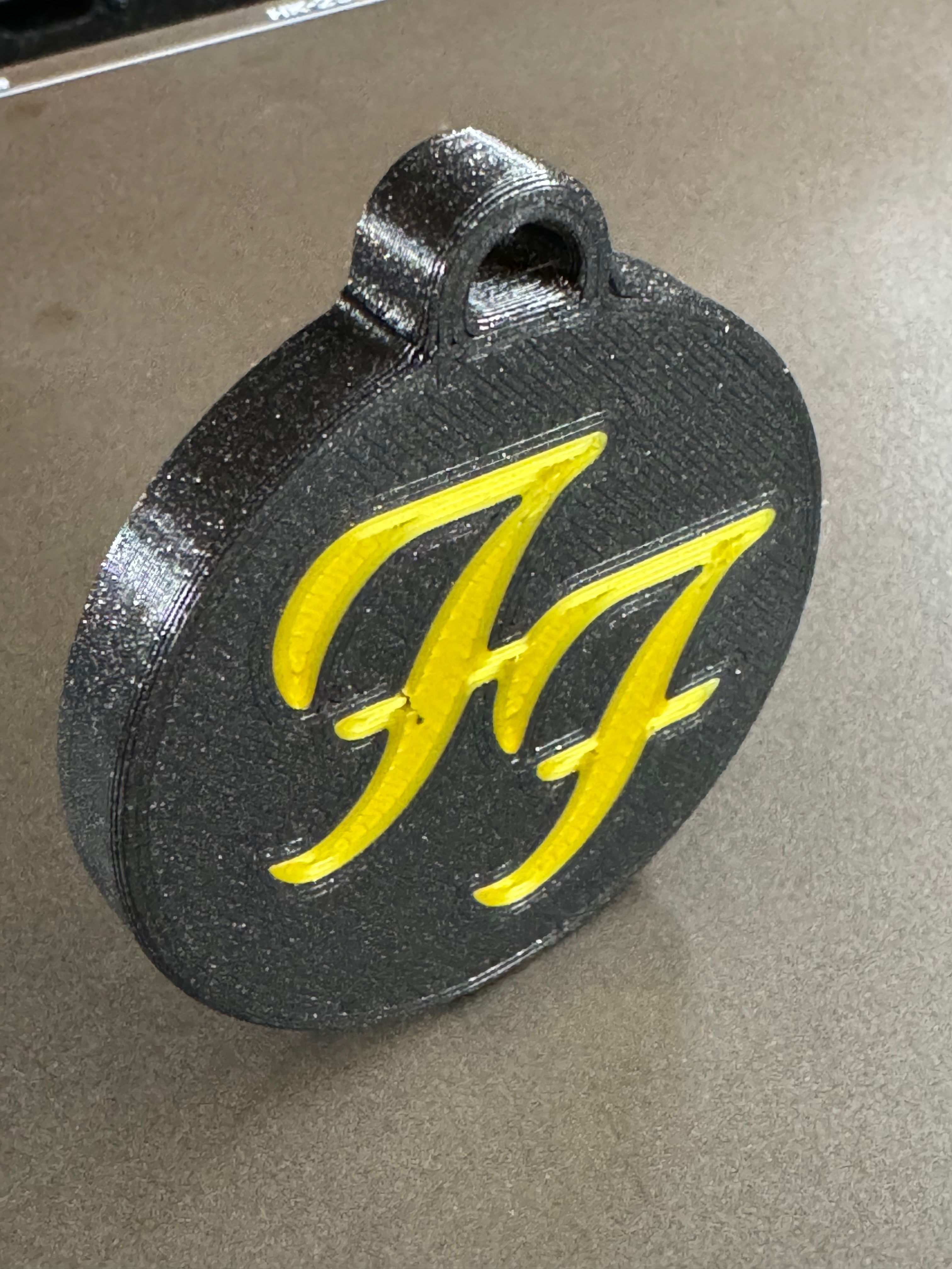 Foo Fighters double-sided bag tag / keychain