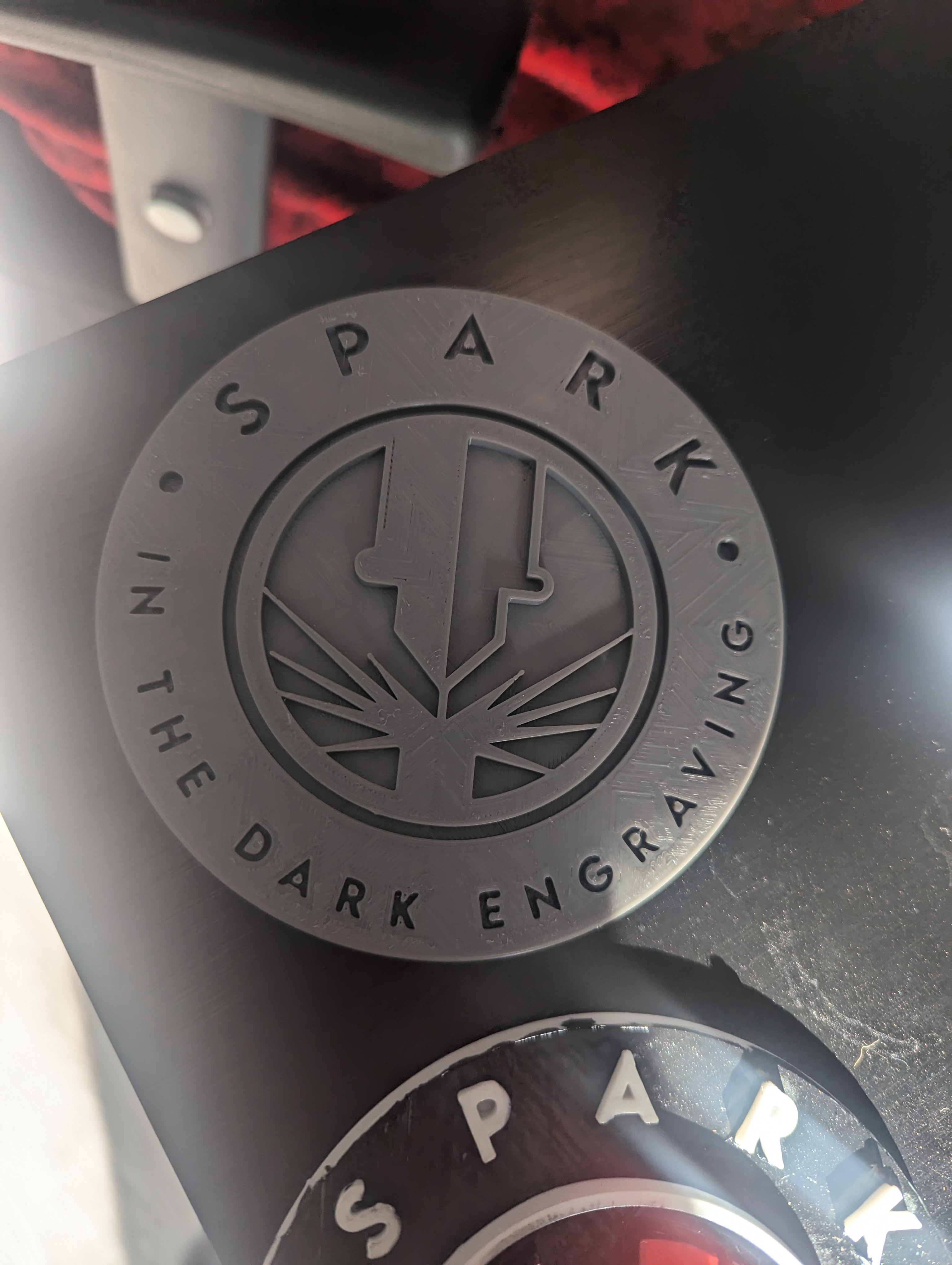 Spark in the dark laser engraving logo