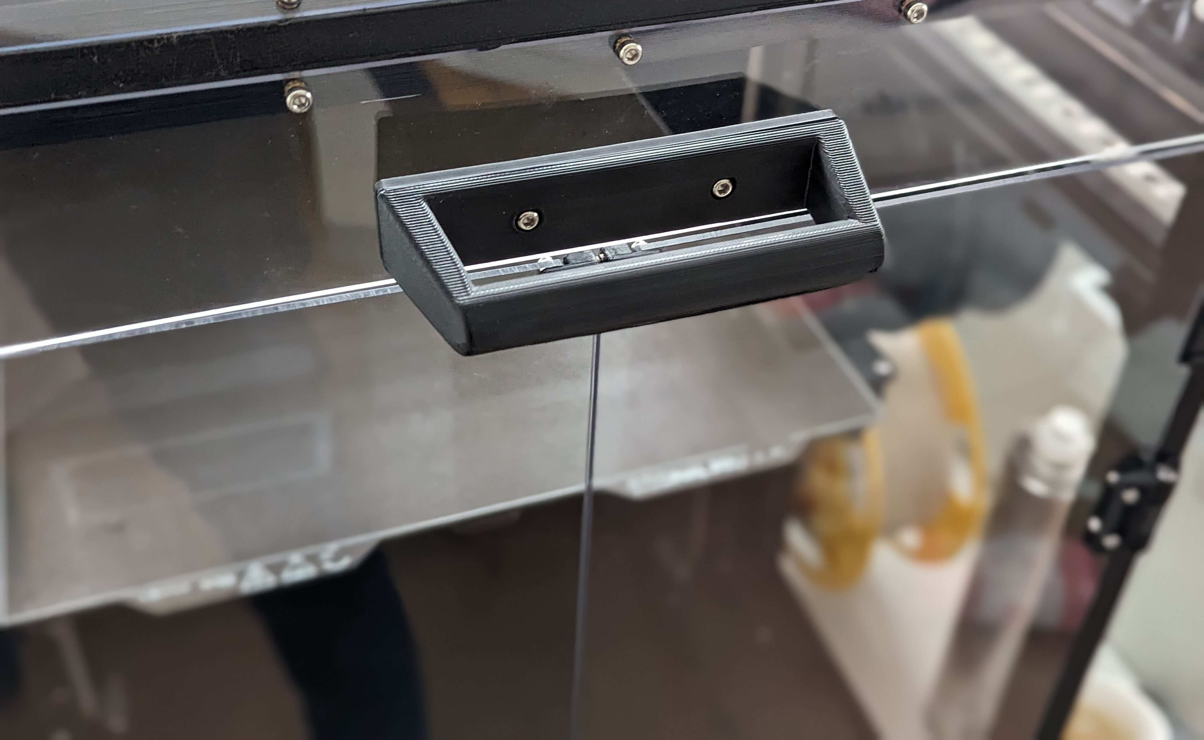 Ergonomic doorhandle for enXLosure