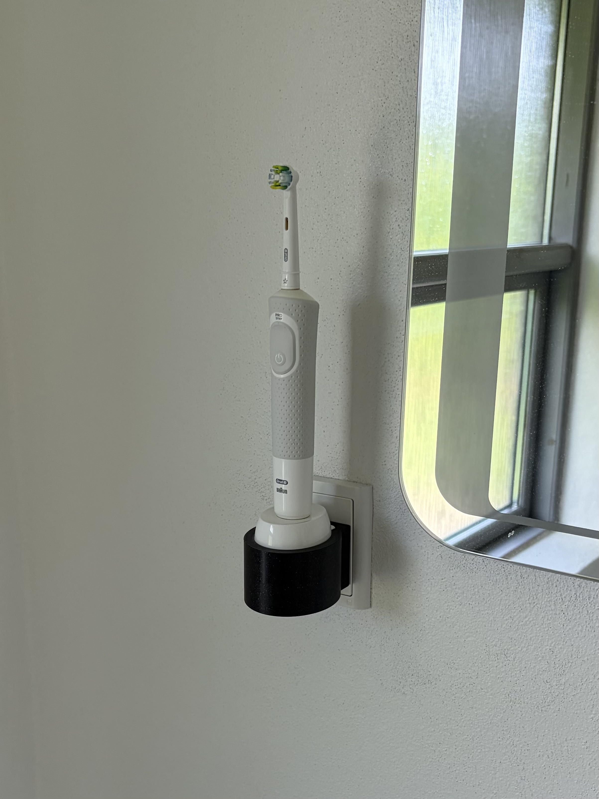 Oral-B Braun toothbrush mount designed specifically to a Danish power outlet