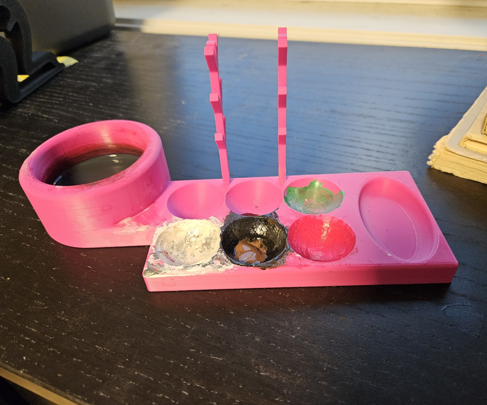 Paint palette with brushholder, mixingtray and washingtray